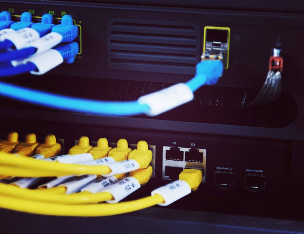 image of cables connecting to server at IT company