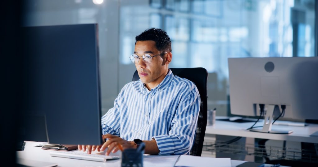 man in office reviewing company's disaster recovery plan