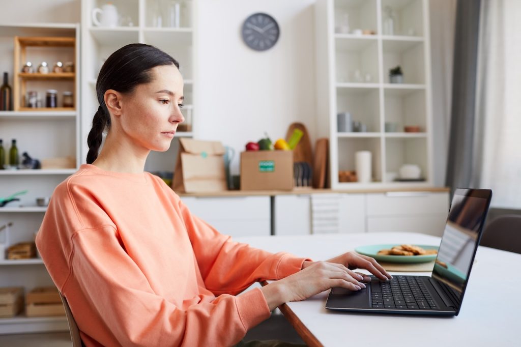 woman working from home receiving remote it support for employees