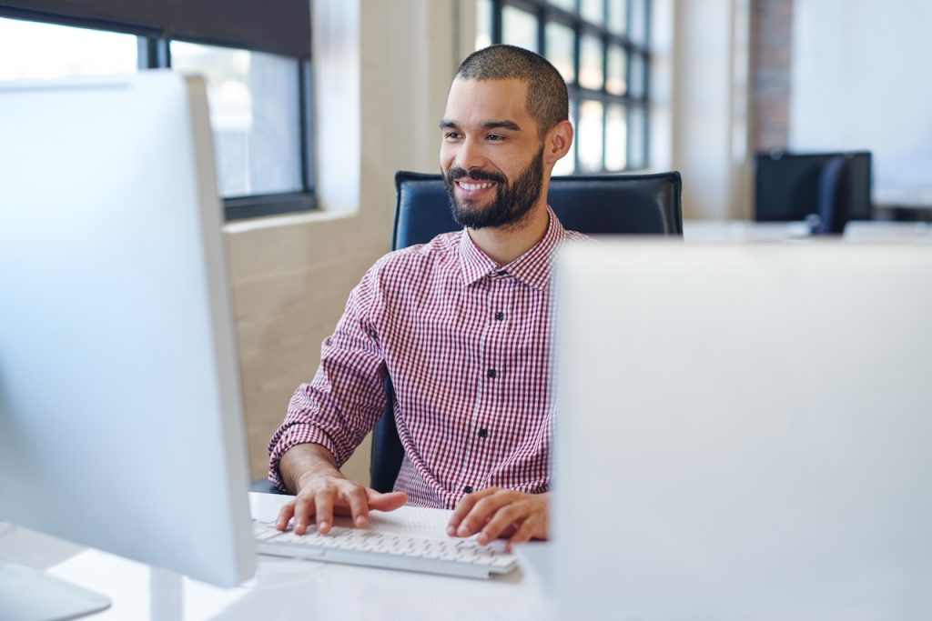 man working in office using managed it support services