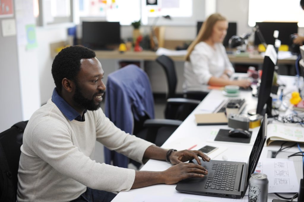 coworkers in the office using it security services to remain protected