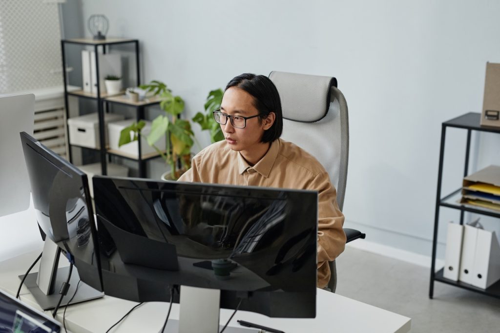 man working in office using computer and network security