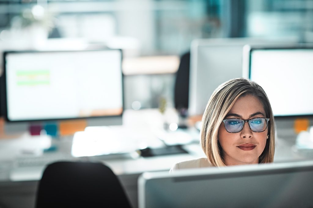 female employee on computer using server cloud backup