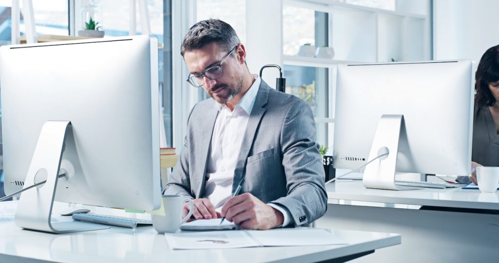 man working on computer in office