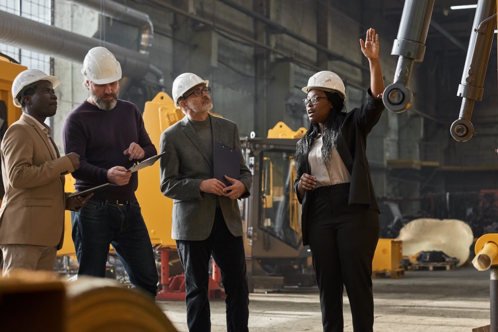 construction engineers analyzing equipment
