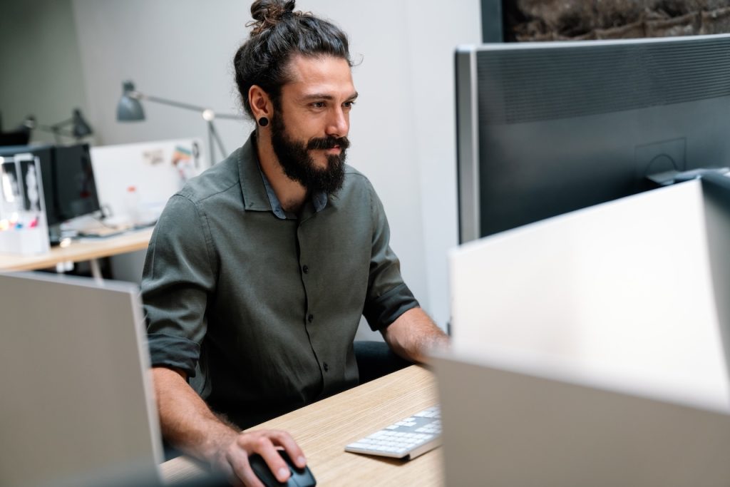 male employee working on computer in office