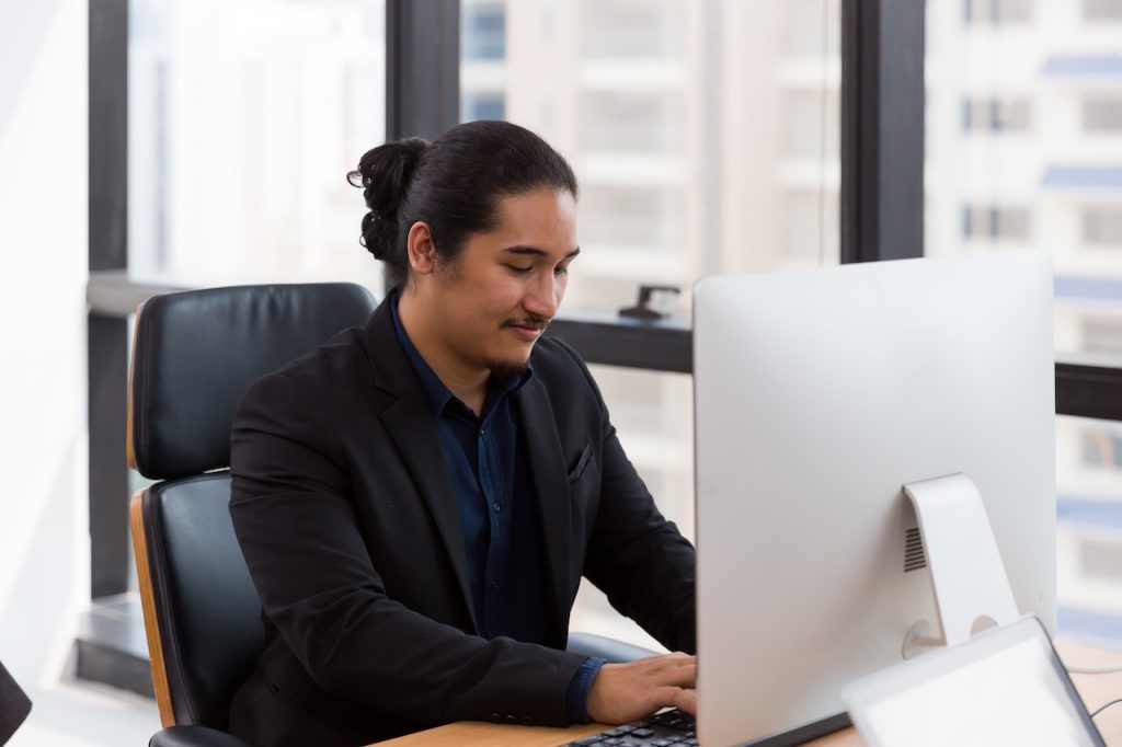 employee working on computer in office