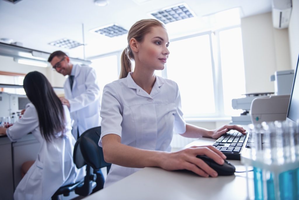 medical professionals working on computers using healthcare data security protocols