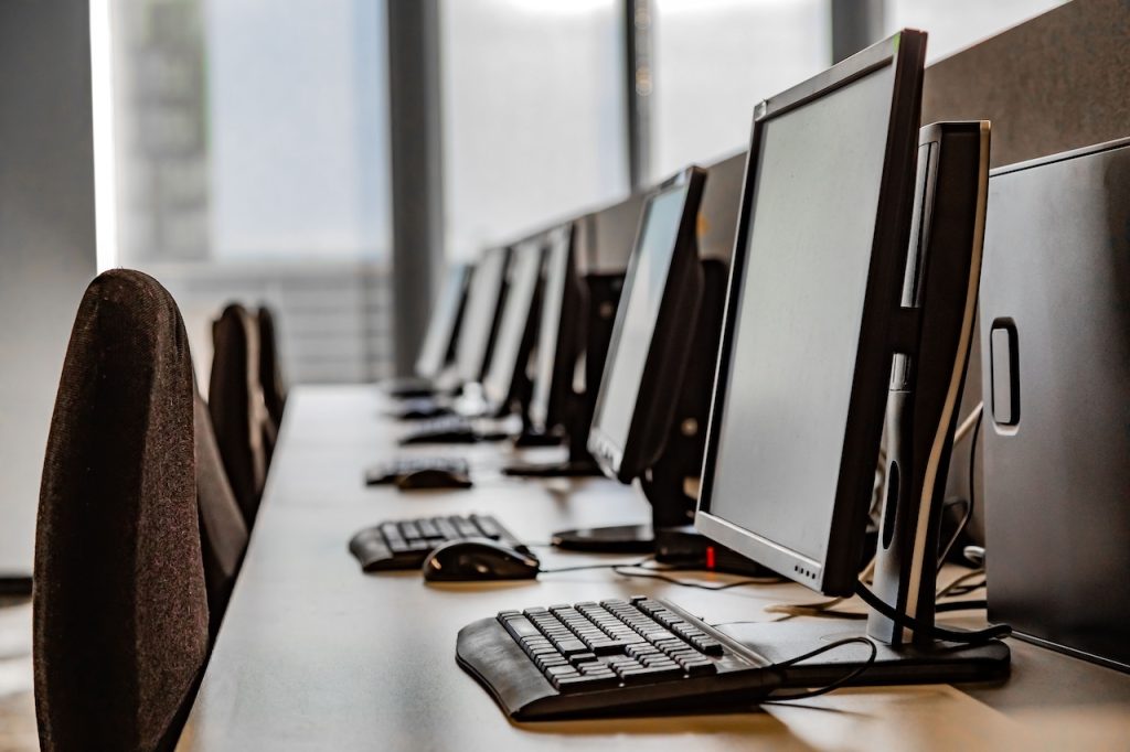 row of computer workstations in office