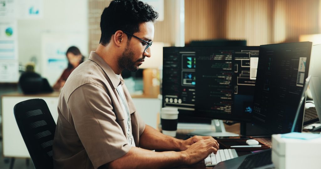 focused employee working on computer in office